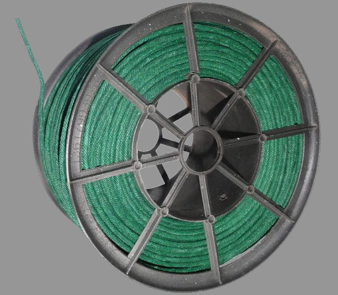 A spool of green Visco fireworks fuse resting on a neutral surface.