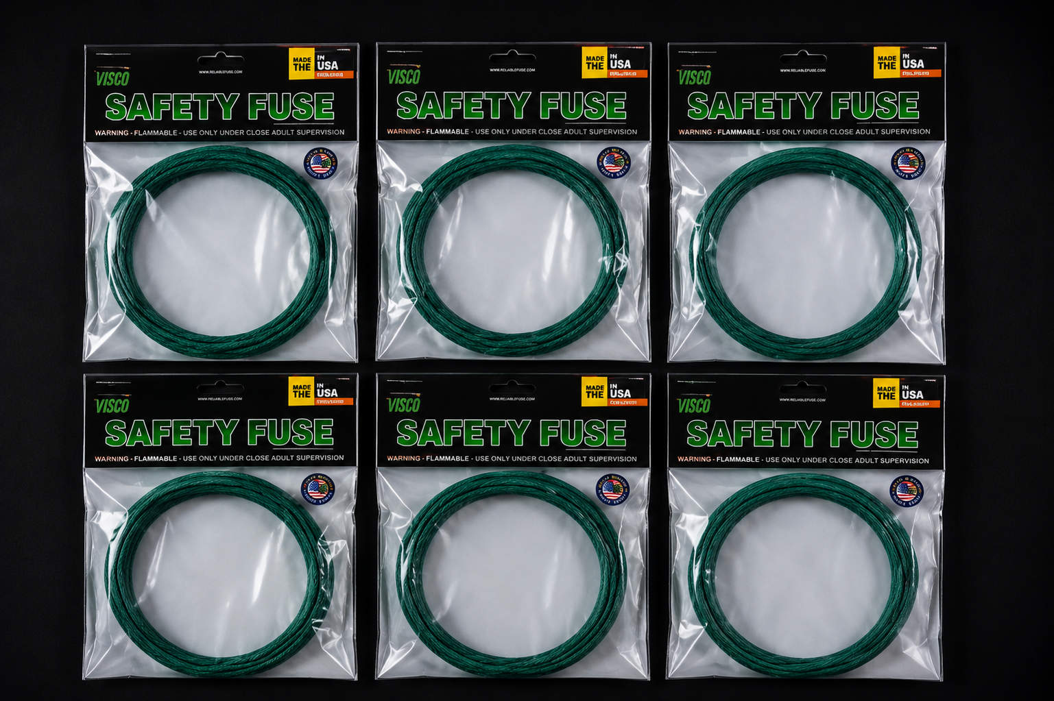 visco-safety-fuse-packages Six retail packages of green Visco safety fuse arranged neatly in two rows against a black background.
