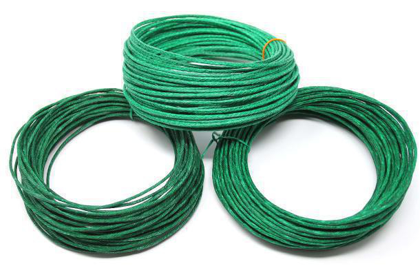 Three large, unpackaged coiled rolls of green Visco safety fuse stacked together on a white background.